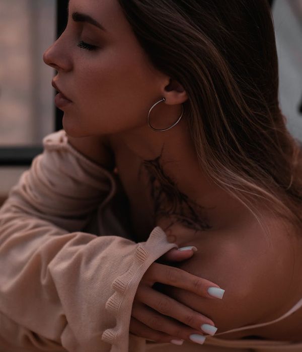 Serene woman looking into the distance in a bright room